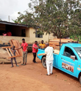 Image showing the unloading of bed frames for the Faith Needy Children’s Home Initiative