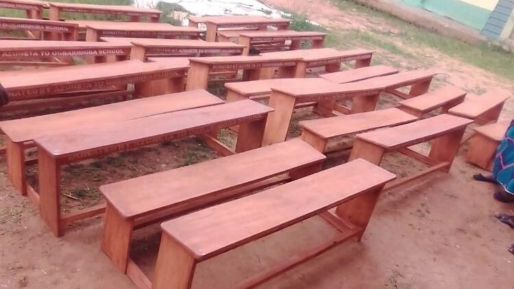 Donated school desks are being displayed.